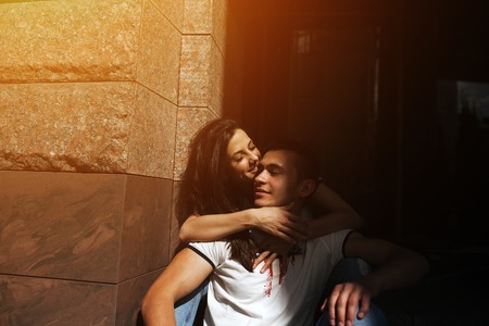 man and woman posing and have fun in the old townの写真素材