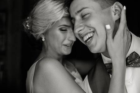 Beautiful wedding couple posing in the doorwayの写真素材