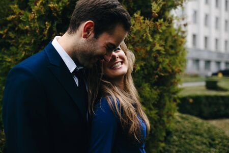 Girl and boy posing in the parkの写真素材