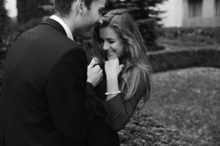 Girl and boy having fun in a small parkの写真素材