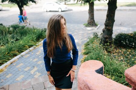 young beautiful girl posing in the streetの写真素材