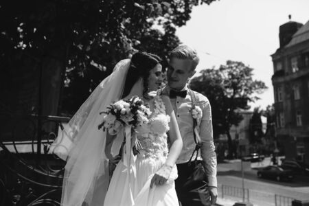 bride and groom posing on the streets of the old townの写真素材