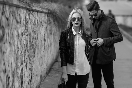Photo of a young beautiful couple on the city streetの写真素材