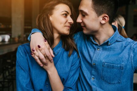 handsome guy and beautiful girl having fun indoorsの写真素材