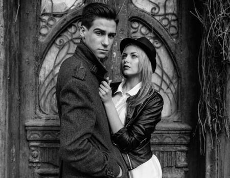 young beautiful couple posing on the background of an old buildingの写真素材