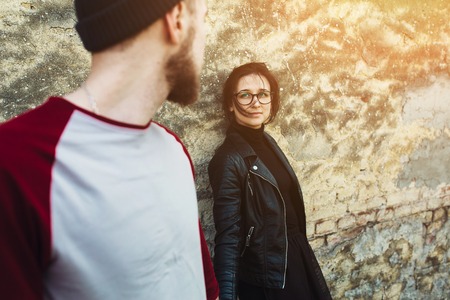 couple posing on a background of the old wallの写真素材