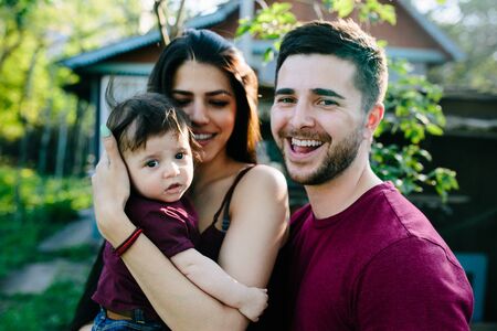young family on the nature in the countryside