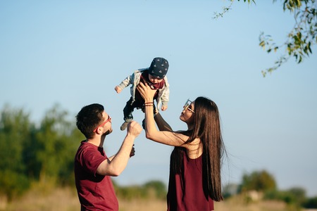 young family have fun and relaxing outdoors in the countrysideの写真素材