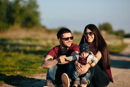 young family have fun and relaxing outdoors in the countryside