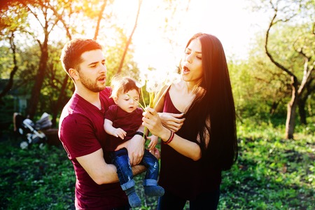 young family on the nature in the countrysideの写真素材
