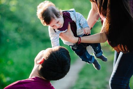 young family have fun and relaxing outdoors in the countrysideの写真素材
