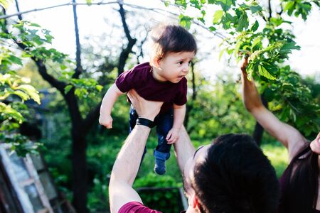 young family on the nature in the countrysideの写真素材