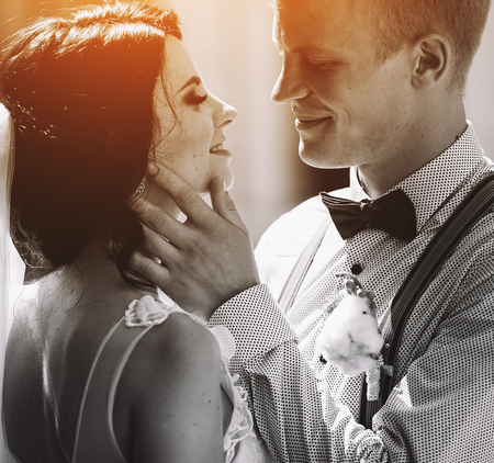 The bride and groom posing in the old street, close angleの写真素材