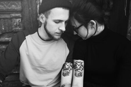 young beautiful couple posing on the background of an old buildingの写真素材