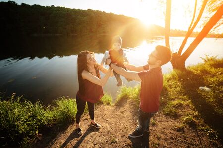 young family have fun and relaxing outdoors in the countrysideの写真素材