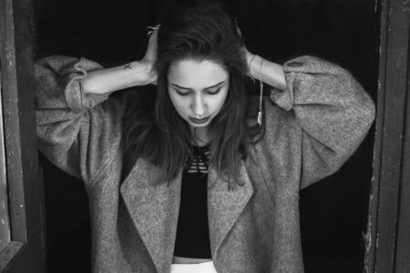 young beautiful model posing on a black backgroundの写真素材