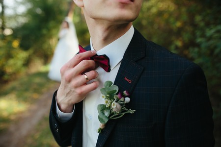 Beautiful wedding couple posing in a forestの写真素材