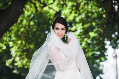 young beautiful bride poses for the camera
