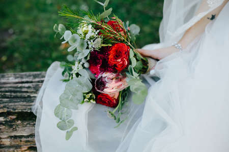 Bride holding wedding bouquet in her hands, close viewの写真素材