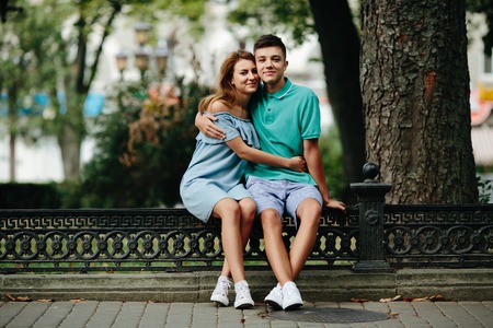 guy and girl in a park posing on cameraの写真素材