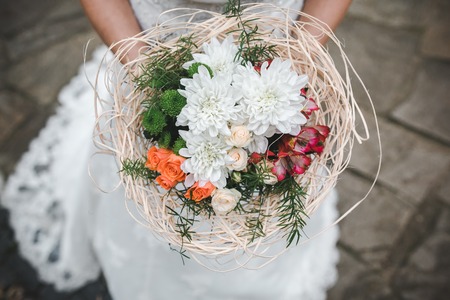 Bride holding wedding bouquet in her hands, close viewの写真素材