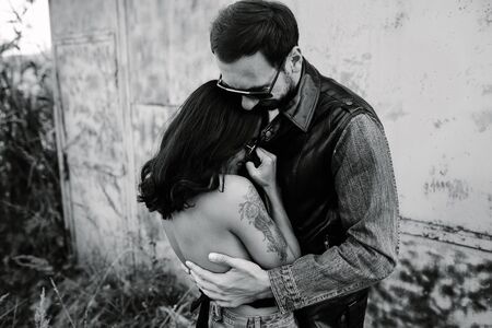 man and woman in an abandoned place posing to the camera