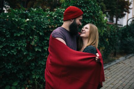 couple posing in the park. A bearded man. Girl with long hair.の写真素材