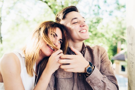 man and woman in a park posing on cameraの写真素材