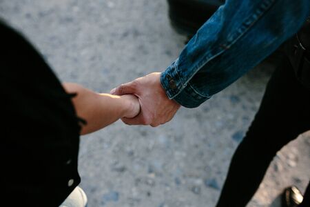 Conceptual image of female and male hands togetherの写真素材
