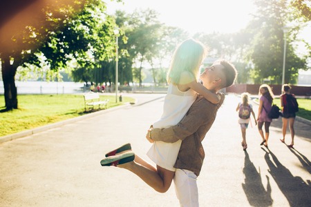 man and woman in a park posing on cameraの写真素材