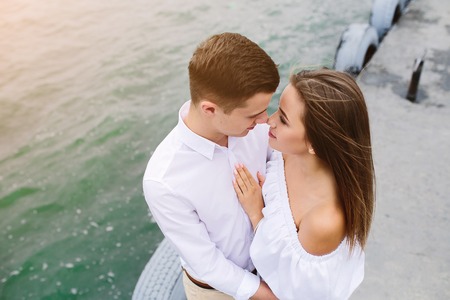 man and woman posing on the lake at the cameraの写真素材