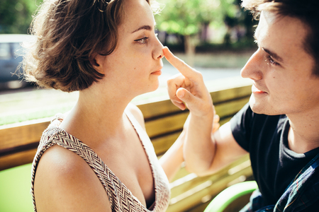 guy and the girl sitting in a cafe outsideの写真素材