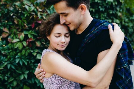 guy and girl in a park posing on cameraの写真素材