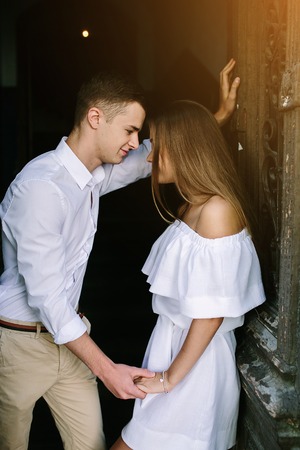 couple posing in the doorway posing on camera