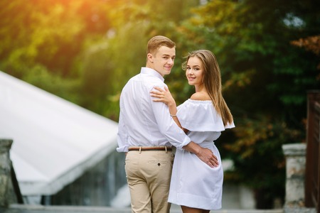 man and woman posing on the streetの写真素材