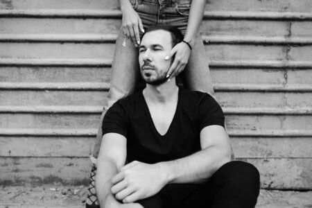 man and woman posing on a background gray wallの写真素材