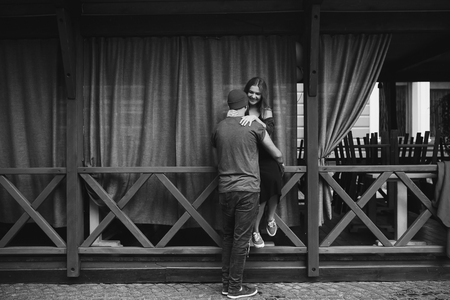A loving couple walking through the city. A bearded man. Girl with long hair.の写真素材