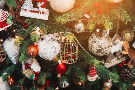 Christmas toys on the Christmas tree with a close angleの写真素材