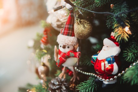 Christmas toys on the Christmas tree with a close angleの写真素材