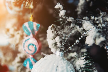 Christmas toys on the Christmas tree with a close angleの写真素材