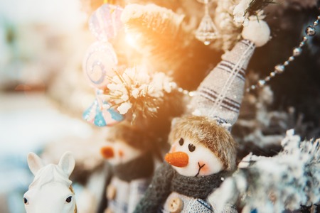 Christmas toys on the Christmas tree with a close angleの写真素材