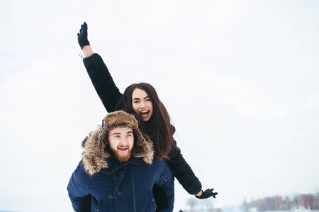 man and woman having fun and playing outdoorsの写真素材