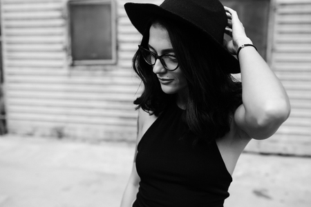 girl posing against a background of a Man and wallの写真素材