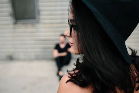 girl posing against a background of a Man and wallの写真素材