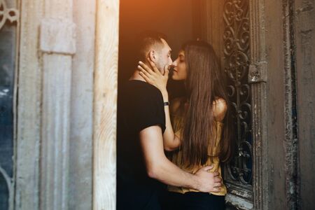 couple posing in the doorway posing on cameraの写真素材