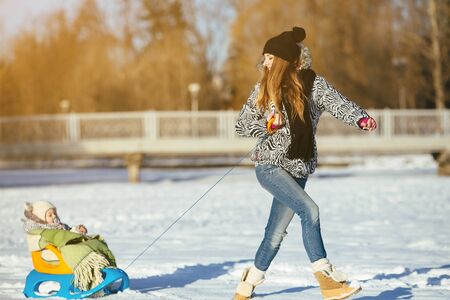 mother and daughter in winter outdoorsの写真素材