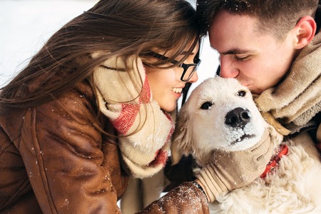 Young couple having fun in winter parkの写真素材