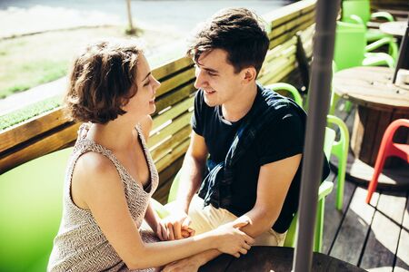 couple sitting in a cafe outside