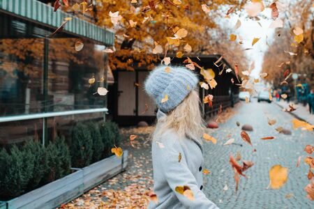 Beautiful young caucasian woman in an autumnal landscapeの写真素材