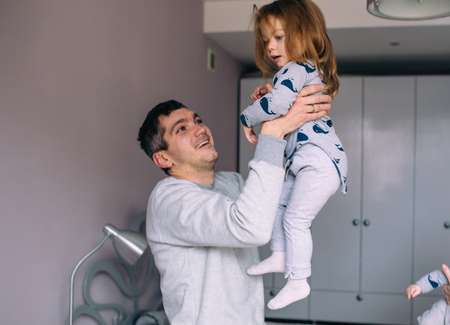 Father playing with his daughterの写真素材